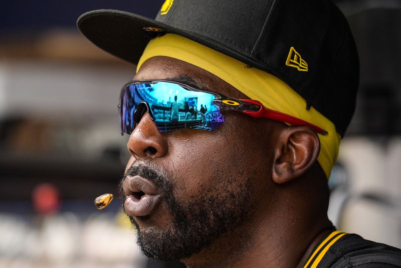 Pittsburgh Pirates outfielder Andrew McCutchen (22) sits in the dugout in the third inning of a baseball game against the Atlanta Braves, Saturday, June 29, 2024, in Atlanta. (AP Photo/Mike Stewart)