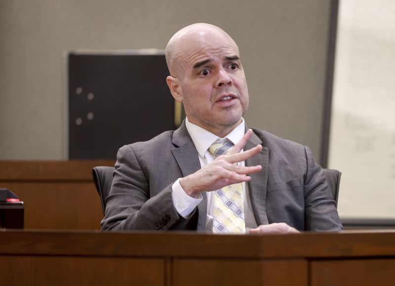 Robert Telles shows how he cut his finger while addressing the jury from the witness stand during the eighth day of his murder trial at the Regional Justice Center in Las Vegas, Wednesday, Aug. 21, 2024. Telles, a former Clark County public administrator, is charged with murdering Las Vegas Review-Journal investigative reporter Jeff German. (KM Cannon/Las Vegas Review-Journal via AP)