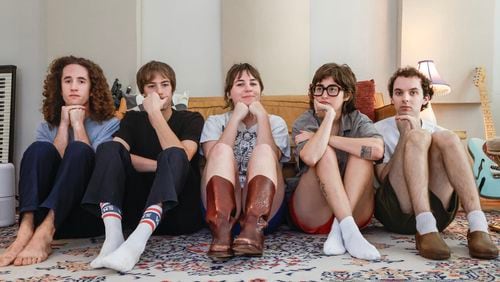 Rock band Lunar Vacation poses for a portrait inside their home studio in Decatur on Tuesday, Aug. 20, 2024. (Natrice Miller/AJC)