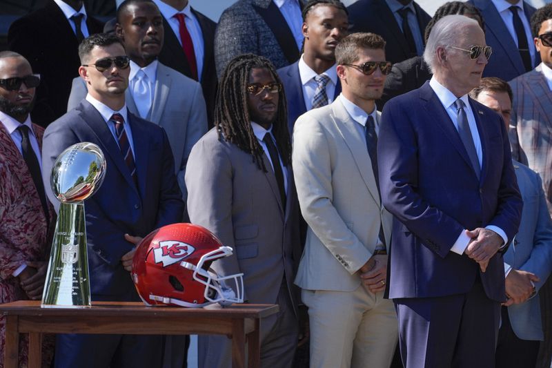 President Joe Biden, right, stands with members of the Kansas City Chiefs during an event with the Super Bowl-champion Chiefs on the South Lawn of the White House, Friday, May 31, 2024, to celebrate their championship season and victory in Super Bowl LVIII. (AP Photo/Evan Vucci)
