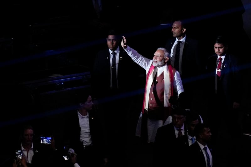 Narendra Modi, Prime Minister of India, waves to the crowd after speaking at an event in Uniondale, N.Y., Sunday, Sept. 22, 2024. (AP Photo/Seth Wenig)