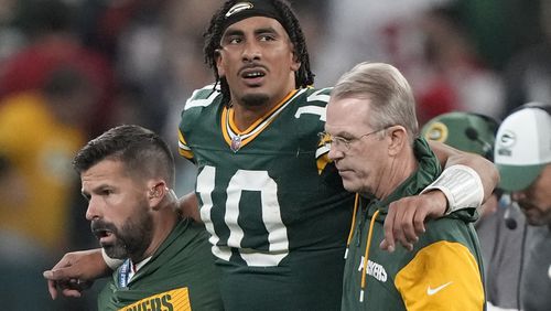 Green Bay Packers quarterback Jordan Love (10) in helped off the field after getting hurt during the second half of an NFL football game against the Philadelphia Eagles, Saturday, Sept. 7, 2024, at the Neo Quimica Arena in Sao Paulo. (AP Photo/Doug Benc)