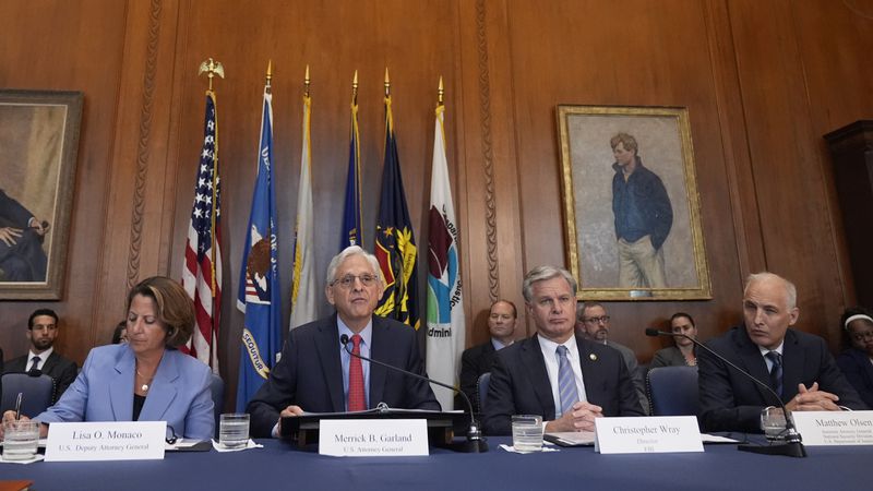 Attorney General Merrick Garland speaks before a meeting of the Justice Department's Election Threats Task Force, at the Department of Justice, Wednesday, Sept. 4, 2024, in Washington, with Deputy Attorney General Lisa Monaco, left, FBI Director Christopher Wray, center right, and Assistant Attorney General, National Security Division, Matthew Olsen, right. (AP Photo/Mark Schiefelbein)