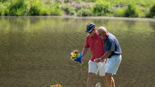 210706-Kennesaw-Mourners drop off flowers and a golf ball Tuesday afternoon, July 6, 20201, while paying their respect to golf pro Gene Siler, who was shot and killed Saturday afternoon on the 10th green of the Pinetree Country Club in Kennesaw. Ben Gray for the Atlanta Journal-Constitution