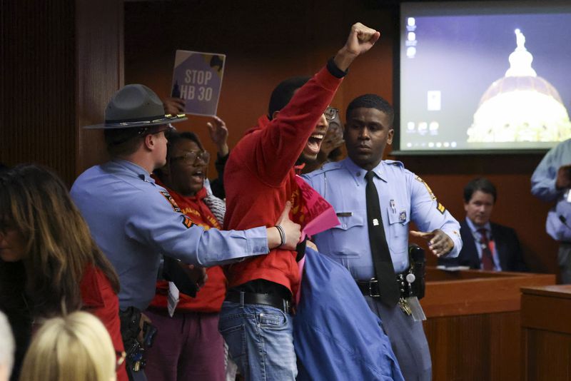 A protester yells,”Free, free Palestine” after the Senate Judiciary Committee passed an antisemitism bill Monday. Some protesters were removed from the room. (Jason Getz/jason.getz@ajc.com)