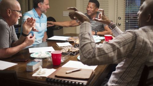 Lee Jenkins, senior pastor at Eagles Nest Church in Roswell, jokes with the group of participants in the “Conversations” movement, a series of joint discussions about race. The group was meeting at Eddie L. Johnson’s house in Alpharetta to discuss racial issues over supper. (AJC 2020)