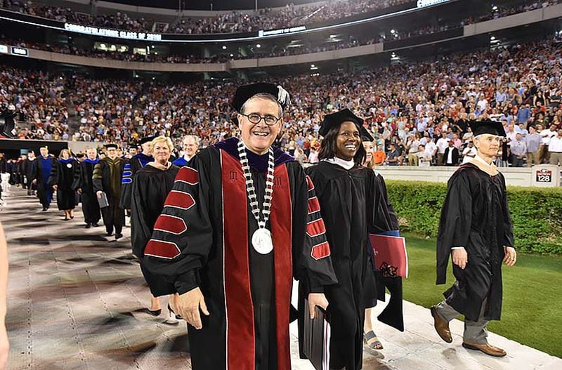 May 10, 2019 Athens - Jere Morehead, president of the University of Georgia, and Deborah Ann Roberts (second from left), commencement speaker, leave after UGA's 2019 spring undergraduate commencement ceremony at Sanford Stadium in Athens on Friday, May 10, 2019. HYOSUB SHIN / HSHIN@AJC.COM