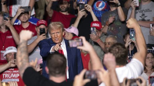 Republican presidential nominee former President Donald Trump points towards the crowd as he arrives for a campaign rally at Ed Fry Arena in Indiana, Pa., Monday, Sept. 23, 2024. (AP Photo/Rebecca Droke)