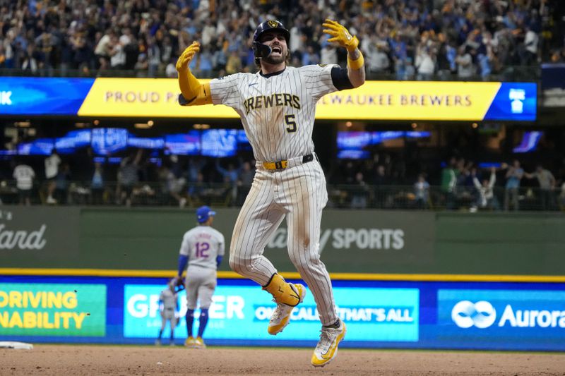 Milwaukee Brewers' Garrett Mitchell celebrates afrer hitting a two-run home run during the eighth inning of Game 2 of a National League wild card baseball game against the New York Mets Wednesday, Oct. 2, 2024, in Milwaukee. (AP Photo/Morry Gash)