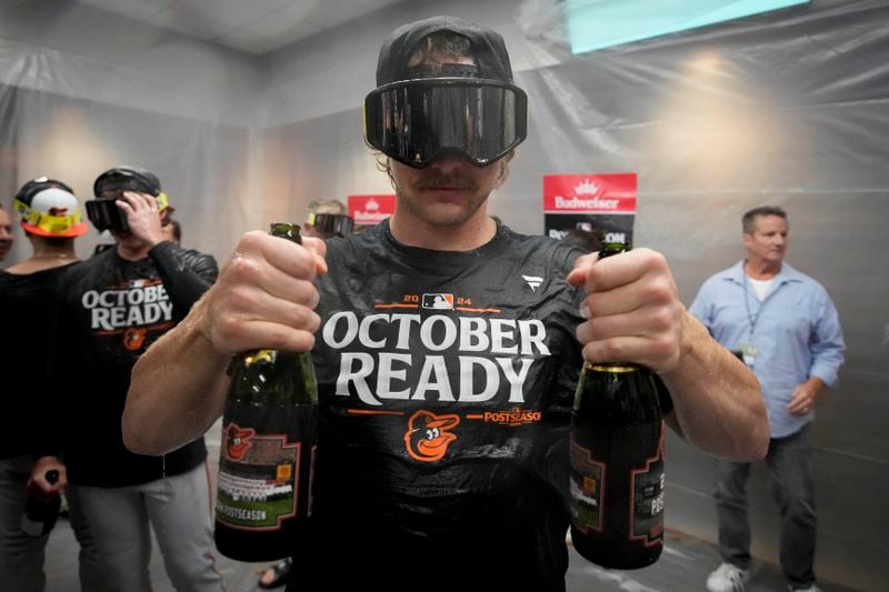 Baltimore Orioles' Gunnar Henderson celebrates after the team clinched a playoff berth by defeating the New York Yankees in baseball game, Tuesday, Sept. 24, 2024, in New York. (AP Photo/Bryan Woolston)