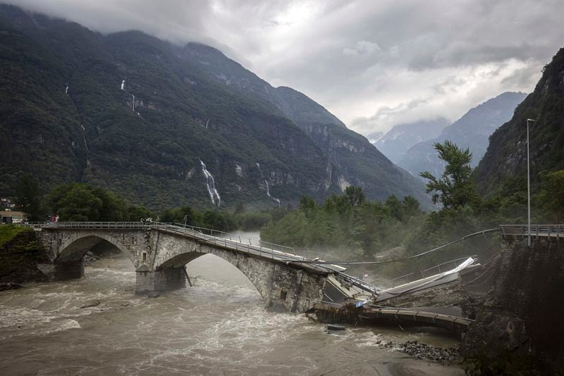 The bridge in Visletteo destroyed due to the storm, in Visletto, in the Maggia Valley, southern Switzerland on Sunday June 30, 2024. The storm in the night from Saturday to Sunday destroyed various traffic routes. Following the landslide in the Maggia Valley, rescuers recovered two bodies on Sunday. One person is still missing, according to the Ticino cantonal police in Valle Maggia. (Michael Buholzer/Keystone via AP)