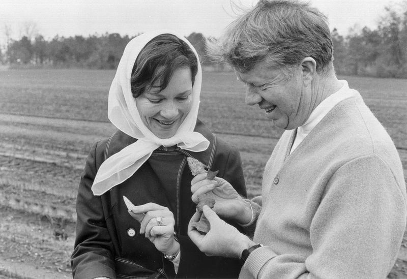 In this undated photo, Jimmy and Rosalynn Carter look at arrowheads in a field. (Carter family photo / Jimmy Carter Library)
