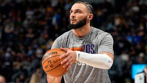 FILE - Phoenix Suns forward David Roddy (21) warms up before an NBA basketball game Tuesday, March 5, 2024, in Denver. The Atlanta Hawks acquired David Roddy from the Phoenix Suns in exchange for E.J. Liddell in a swap of power forwards on Monday, July 29, 2024. (AP Photo/David Zalubowski, File)