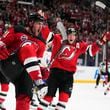 New Jersey Devils' Stefan Noesen, left, celebrates after scoring the opening goal during the NHL hockey game between Buffalo Sabres and New Jersey Devils, in Prague, Czech Republic, Friday, Oct. 4, 2024. (AP Photo/Petr David Josek)