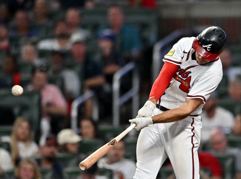 Atlanta Braves first baseman Matt Olson (28) hits a solo home run during the sixth inning at Truist Park. (Hyosub Shin / Hyosub.Shin@ajc.com)