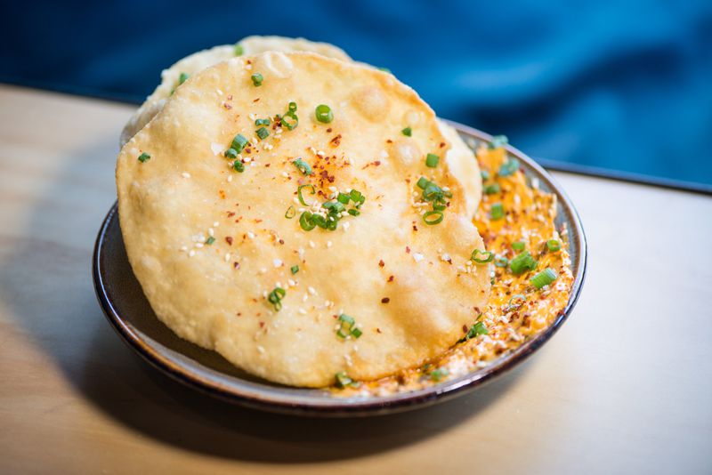 Fry Bread with pepperoni butter, sesame, and scallions. Photo credit- Mia Yakel.