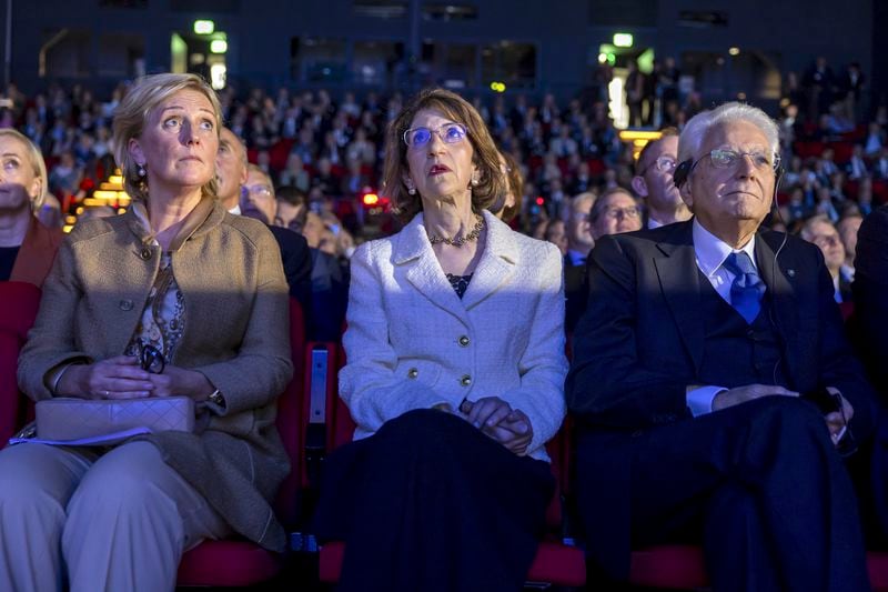 Princess of Belgium Astrid, left, Fabiola Gianotti, centre, Director General of the European Organization for Nuclear Research (CERN) and Italy's President Sergio Mattarella, look at a screen on the occasion of the celebration of CERN's 70th anniversary, at the European Organization for Nuclear Research (CERN), in Meyrin near Geneva, Switzerland, Tuesday, Oct. 1, 2024. (Salvatore Di Nolfi/Keystone via AP)