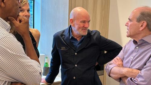 Michael Stipe, lead singer of R.E.M., has an art exhibit "Even the birds gave pause" at Jackson Fine Art in Buckhead and appeared at an opening party Oct. 1 and met patrons. The exhibit runs through Dec. 20. RODNEY HO/rho@ajc.com