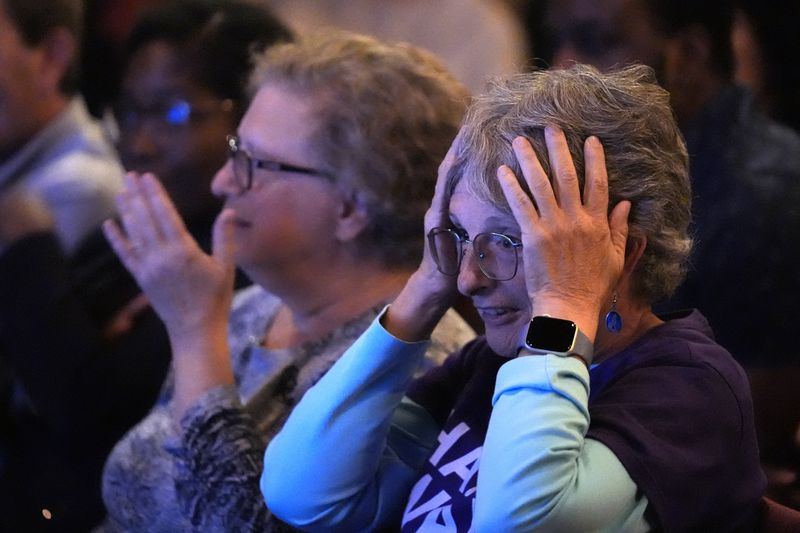 Karen Sellinger reacts to a comment by former President Donald Trump during the presidential debate between Trump and Democratic presidential nominee Vice President Kamala Harris, Tuesday, Sept. 10, 2024, in Portland, Maine. (AP Photo/Robert F. Bukaty)