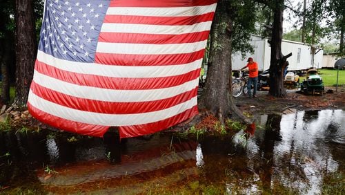 George Smith, 67, from Homerville, arrives at his trailer home riding his bicycle in Homersville, Georgia, on Tuesday, August 6, 2024. “Luckily, nothing big happened around here; just a few trees down,” Smith said.
(Miguel Martinez / AJC)