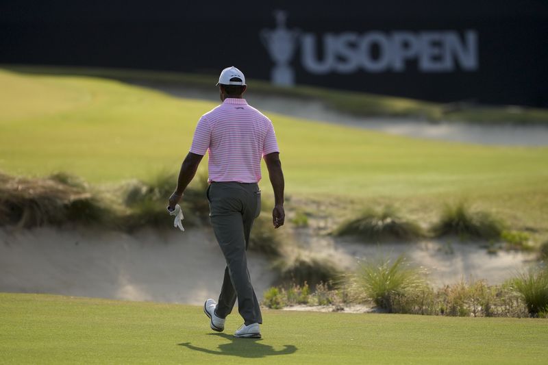 Tiger Woods walks on the 12th hole during the first round of the U.S. Open golf tournament Thursday, June 13, 2024, in Pinehurst, N.C. (AP Photo/Matt York)