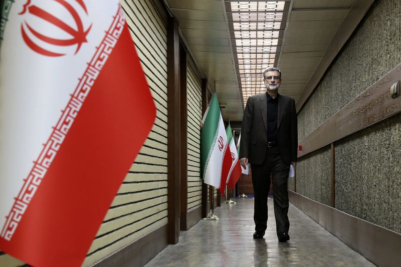 In this picture made available by Iranian state-run TV, IRIB, presidential candidate for the June 28, election Amirhossein Ghazizadeh Hashemi, Vice President of late Ebrahim Raisi, arrives for a debate of the candidates at the TV studio in Tehran, Iran, Thursday, June 20, 2024. (Morteza Fakhri Nezhad/IRIB via AP)