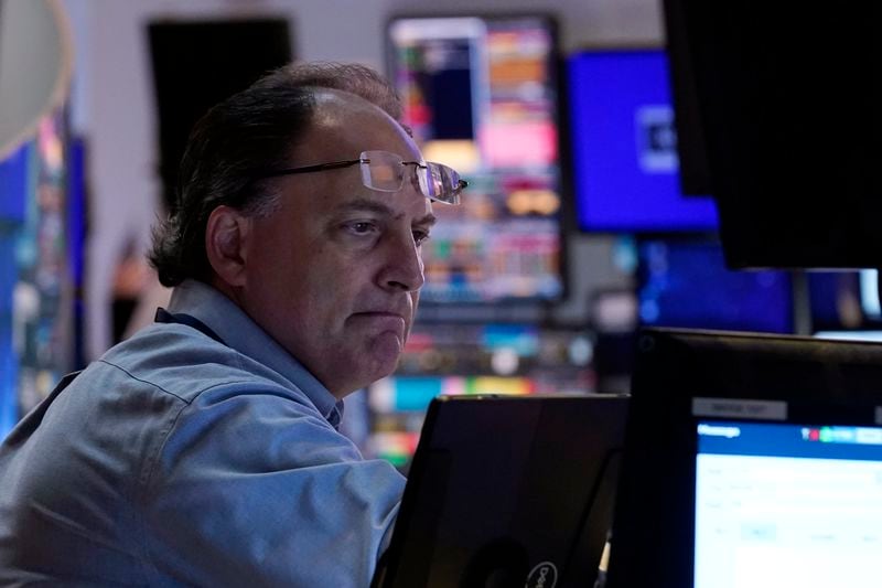 Trader James Conti works on the floor of the New York Stock Exchange, Friday, Aug. 16, 2024. (AP Photo/Richard Drew)