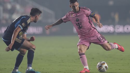 Inter Miami forward Lionel Messi (10) kicks the ball away from Philadelphia Union midfielder Leon Flach (31) during the first half of an MLS soccer match, Saturday, Sept. 14, 2024, in Fort Lauderdale, Fla. (AP Photo/Marta Lavandier)