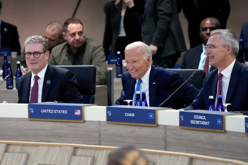 British Prime Minister Keir Starmer, President Joe Biden and NATO Secretary General Jens Stoltenberg take their seats for a meeting of the NATO-Ukraine Council during the NATO summit in Washington, Thursday July 11, 2024. (AP Photo/Jacquelyn Martin)