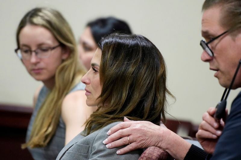 Hillaria Baldwin, wife of actor Alec Baldwin, and his brother Stephen Baldwin, right, react during Alec Baldwin's trial for involuntary manslaughter for the 2021 fatal shooting of cinematographer Halyna Hutchins during filming of the Western movie "Rust," Friday, July 12, 2024, at Santa Fe County District Court in Santa Fe, N.M. The judge threw out the case against Baldwin in the middle of his trial and said it cannot be filed again. (Ramsay de Give/Pool Photo via AP)