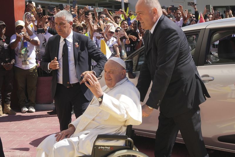 Pope Francis greets before the meeting with young people in Centro de Convencoes in Dili, East Timor, Wednesday, Sept. 11, 2024. (AP Photo/Firdia Lisnawati)