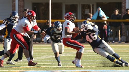 Reinhardt’s Javier Dyer (46) has 10 sacks and 21.5 tackles for loss and fellow defensive end Tevin McCoy (17) has a team-leading 11.5 sacks heading into an NAIA semfinal against the University of Saint Francis (Ind.).Photo credit: G-RoxPhotos.com