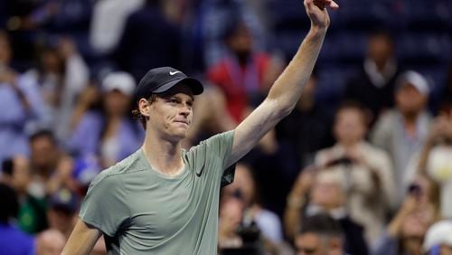 Jannik Sinner, of Italy, acknowledges the crowd after defeating Daniil Medvedev, of Russia, during the quarterfinals of the U.S. Open tennis championships, Wednesday, Sept. 4, 2024, in New York. (AP Photo/Adam Hunger)