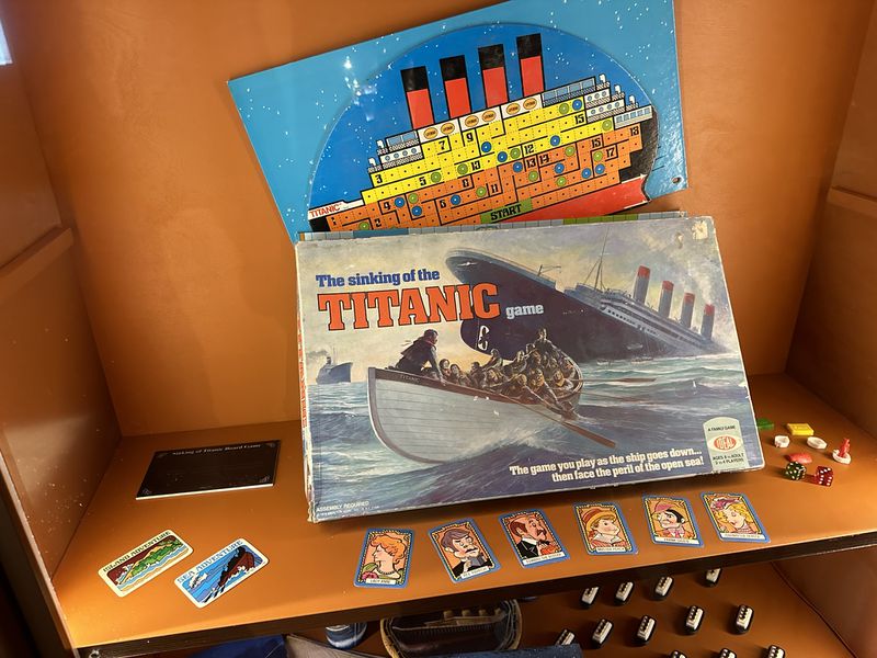 A vintage Titanic board game is displayed at "Titanic: An Immersive Voyage" at Exhibition Hub in Doraville. RODNEY HO/rho@ajc.com