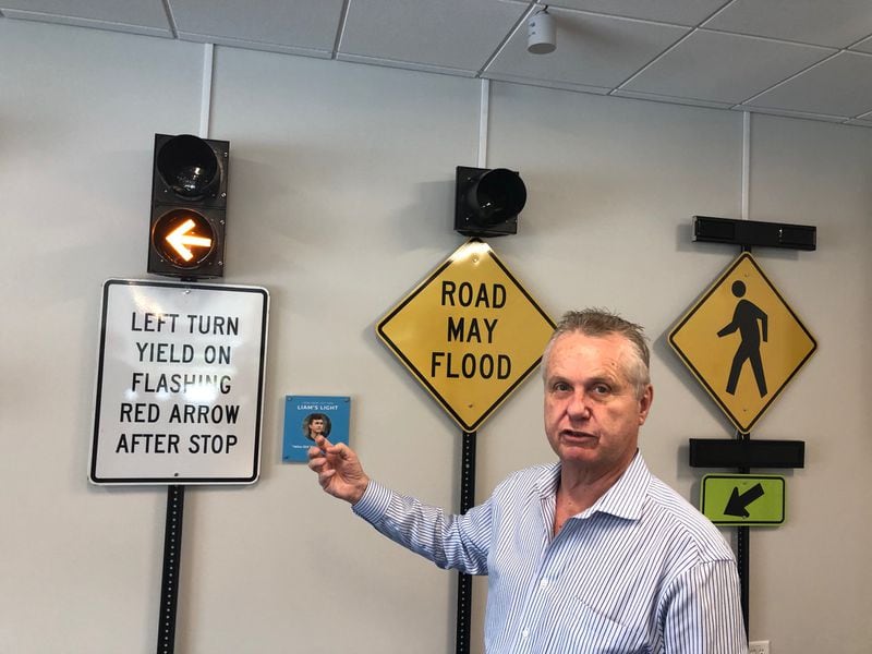 Director Bryan Mulligan shows how different smart traffic signs and signals work at the new iATL connected technology campus in Alpharetta. Credit: Doug Turnbull/WSB