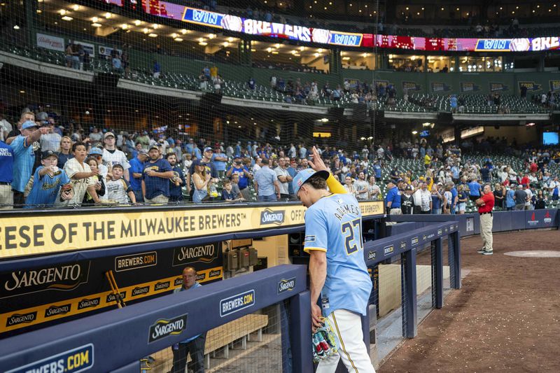 Milwaukee Brewers shortstop Willy Adames (27) waves to the crowd following a baseball game against the Cleveland Guardians, Friday, Aug. 16, 2024, in Milwaukee. (AP Photo/Kayla Wolf)