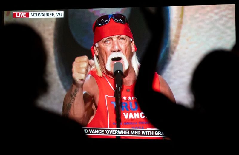 Attendees at a Republican National Convention viewing party in Sandy Springs applauded Thursday as Hulk Hogan spoke. (Seeger Gray/AJC)