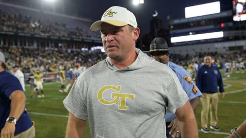 Georgia Tech coach Brent Key leaves the field after the Yellow Jackets beat Duke 23-20 in overtime Oct. 8, 2022 at Bobby Dodd Stadium. (Daniel Varnado/For the AJC)