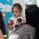 Raleigh Reid, 3, admires toys given to her by Pro and College Football Hall of Famer Champ Bailey at Children’s Healthcare of Atlanta Egleston on Tuesday, Aug. 27, 2024. Egleston is moving all of its patients to the new Arthur M. Blank Hospital. (Natrice Miller/ AJC)