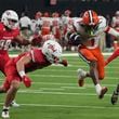 Syracuse running back LeQuint Allen (1) runs the ball by UNLV linebacker Jackson Woodard (7) in the second half during an NCAA college football game, Friday, Oct. 4, 2024, in Las Vegas. (AP Photo/Rick Scuteri)