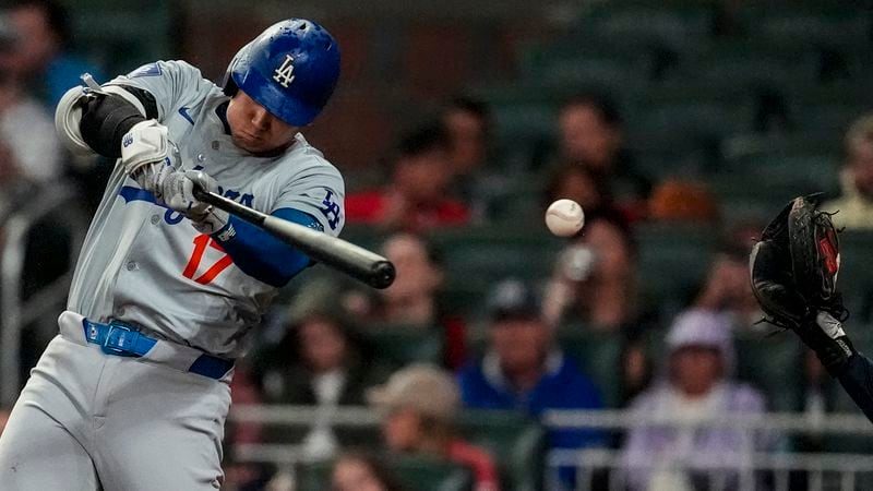 Los Angeles Dodgers' Shohei Ohtani (17) strikes out in the eighth inning of a baseball game against the Atlanta Braves, Friday, Sept. 13, 2024, in Atlanta. (AP Photo/Mike Stewart)