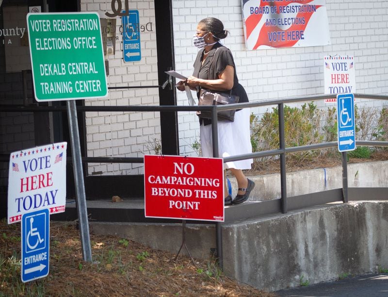 A woman walks into the Dekalb County Voter Registration & Elections Office to vote in Decatur Saturday, May 30, 2020. STEVE SCHAEFER FOR THE ATLANTA JOURNAL-CONSTITUTION