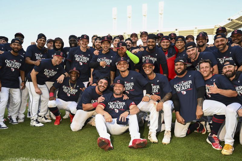 The Cleveland Guardians celebrate after their 10-inning win over the Minnesota Twins in a baseball game, Thursday, Sept. 19, 2024, in Cleveland. (AP Photo/Nick Cammett)