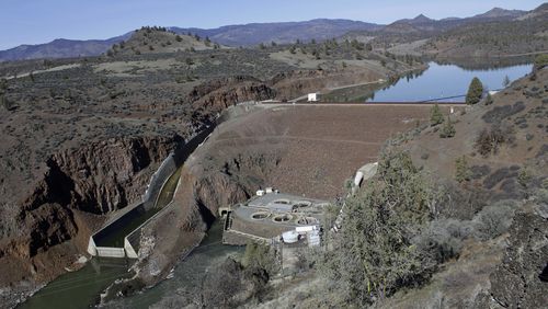 FILE - The Iron Gate Dam powerhouse and spillway are seen on the lower Klamath River near Hornbrook, Calif., March 2, 2020. (AP Photo/Gillian Flaccus, File)