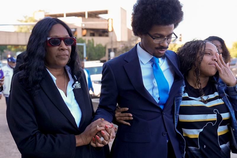 RowVaughn Wells, left, mother of Tyre Nichols, prays with Rep. Justin J. Pearson, D-Memphis, center, enter the federal courthouse for the trial of three former Memphis police officers charged in the 2023 fatal beating of her son Wednesday, Oct. 2, 2024, in Memphis, Tenn. (AP Photo/George Walker IV)