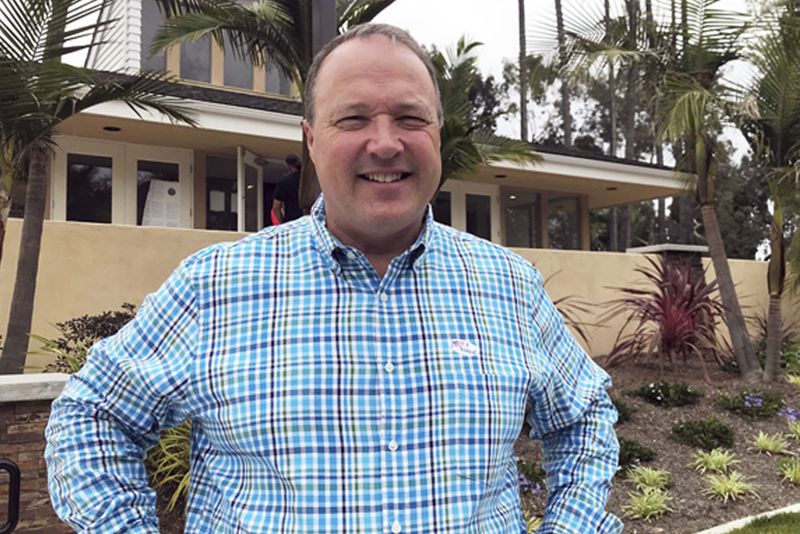 FILE - Scott Baugh, a Republican candidate for Congress from Orange County's 48th District, poses outside a polling place after voting in Huntington Beach, Calif., June 5, 2018. (AP Photo/Krysta Fauria, File)