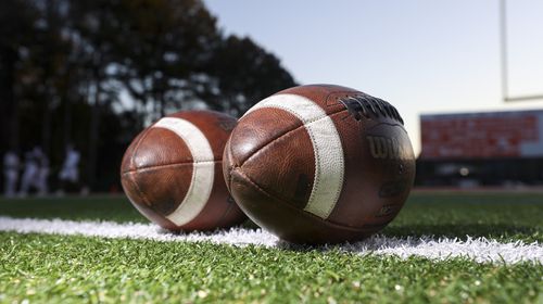 Footballs are shown on the field before the game between Grayson and Parkview at Parkview High School, Friday, November 3, 2023, in Lilburn, Ga. (Jason Getz / Jason.Getz@ajc.com)a