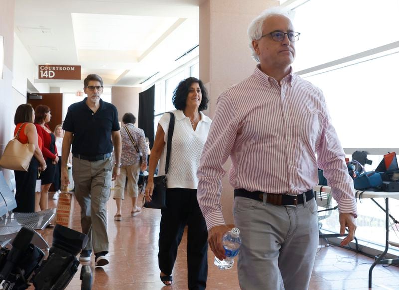 Jill Zwerg, center, a sister of investigative reporter Jeff German, and her brother Jay German, right, leave a courtroom after former Clark County Public Administrator Robert Telles was found guilty of murdering German, at the Regional Justice Center, on Wednesday, Aug. 28, 2024, in Las Vegas, on Wednesday, Aug. 28, 2024, in Las Vegas. (Bizuayehu Tesfaye/Las Vegas Review-Journal via AP)