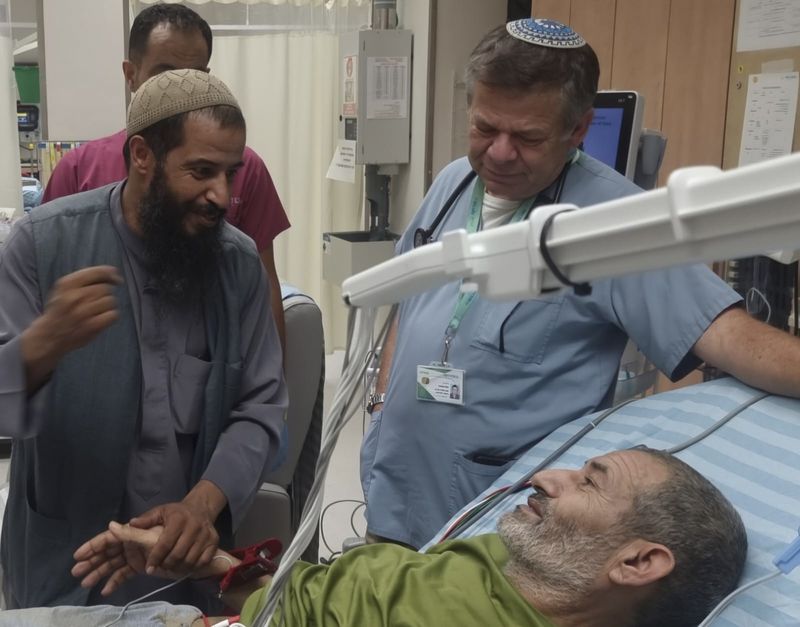 In this photo released by Soroka Medical Center on Tuesday, Aug. 27, 2024, Kaid Farhan Al-Qadi, 52, who was held hostage by Hamas militants in Gaza lies on a bed of the Soroka Medical Center in Beersheba, Israel. (Soroka Medical Center via AP)