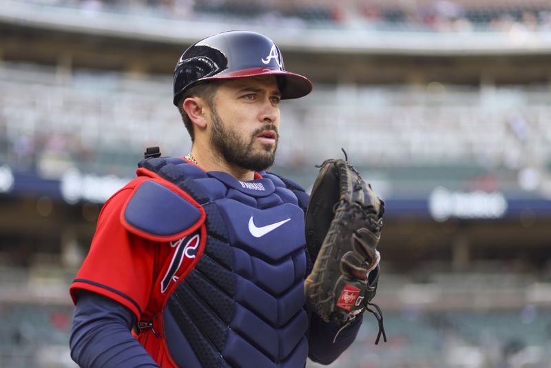 Atlanta Braves catcher Travis d’Arnaud walks onto the field to warms-up before their game against the Philadelphia Phillies at Truist Park, Friday, May 26, 2023, in Atlanta. (Jason Getz / Jason.Getz@ajc.com)